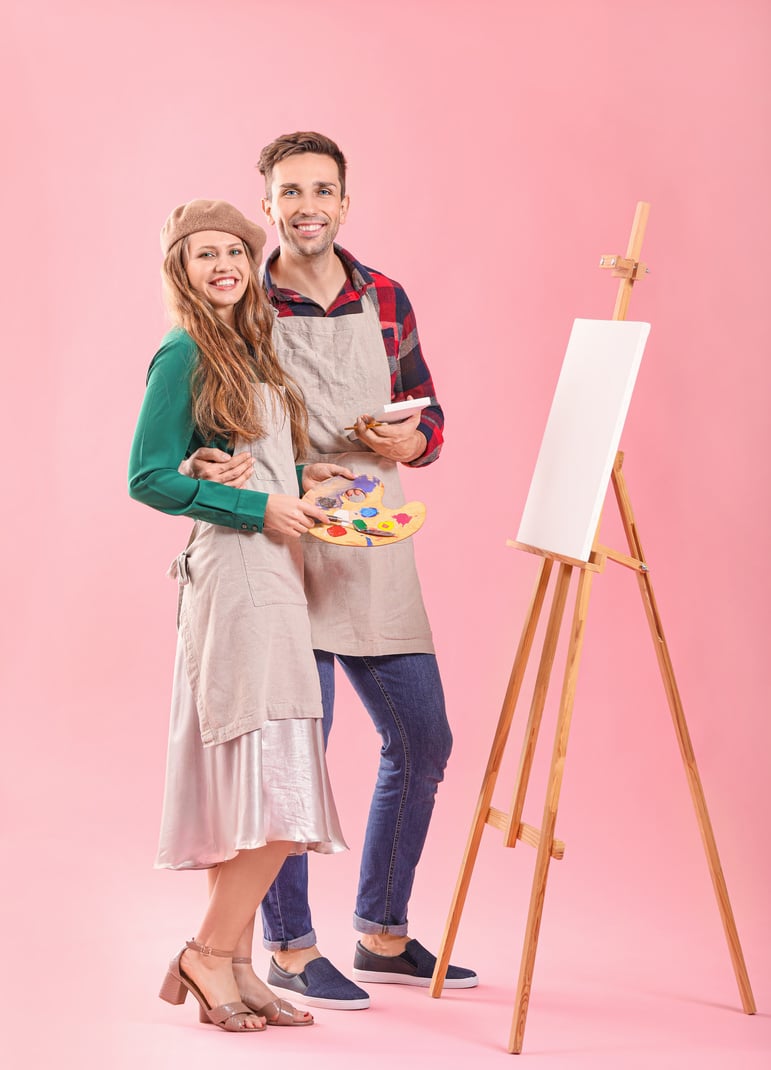 Couple of Young Artists on Color Background