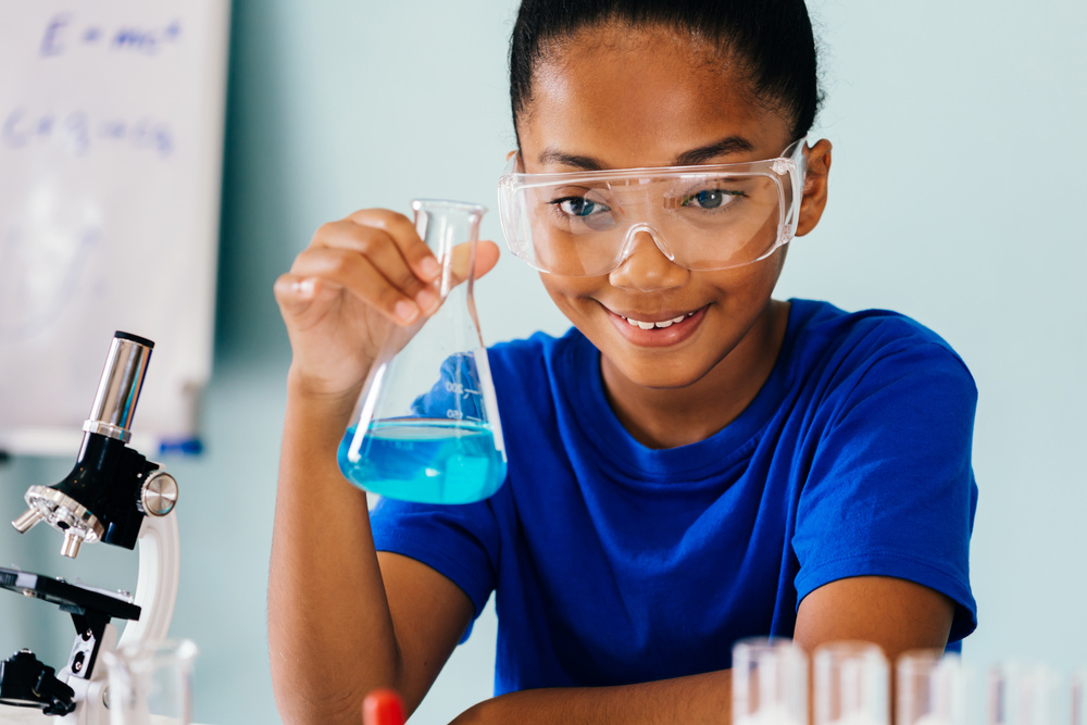 Young African American Kid Doing Chemistry Experiment