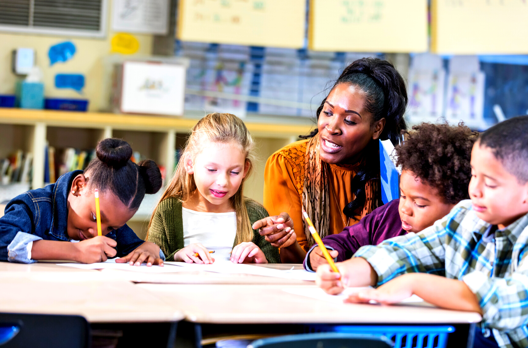 African-American elementary school teacher with class