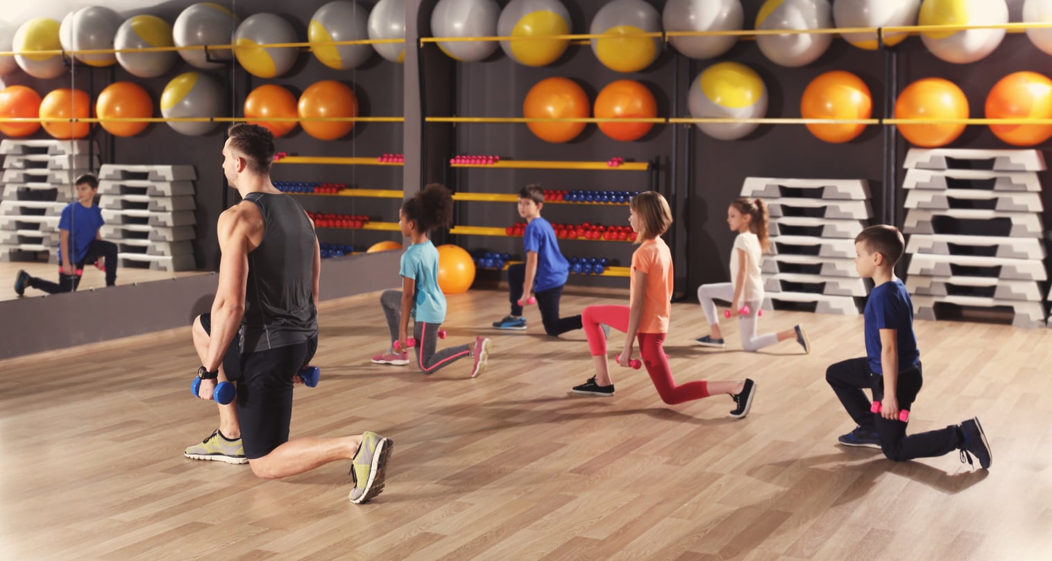 Children at Physical Education Lesson in School Gym